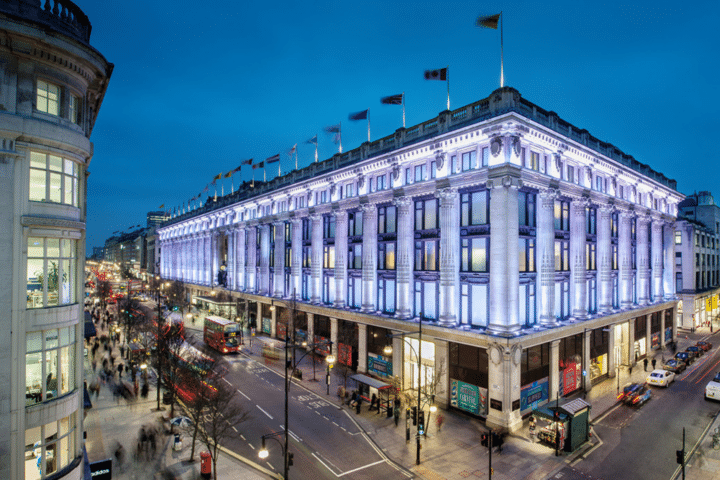 Selfridges London by night scaled