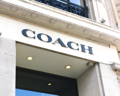 Coach store sign on building exterior